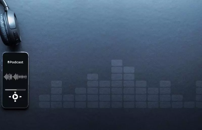 A black smartphone displaying a podcast app sits on a dark blue surface next to a pair of black over-ear headphones, with a stylised background of fading audio level bars.